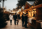 Christmas village in Cyprus with festive lights and wooden stalls at night