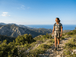 Hikers on a forest trail in Cyprus during spring with green trees and natural light