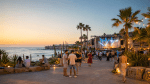 People enjoying a summer event in Cyprus with warm evening light